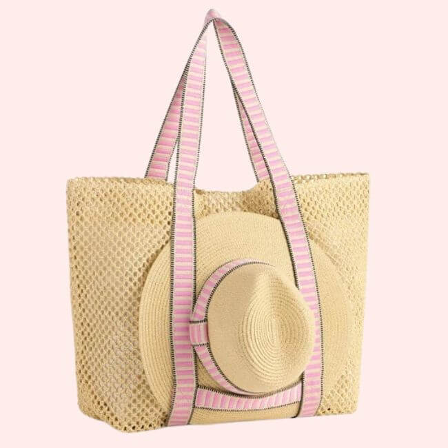 15 Memphis FINDS to Kick Off Summer: Vacation-Ready Style & More - 10 A woven straw tote bag with pink striped handles, featuring a matching sun hat attached to the outside—perfect for Memphis shopping or a sunny day out.