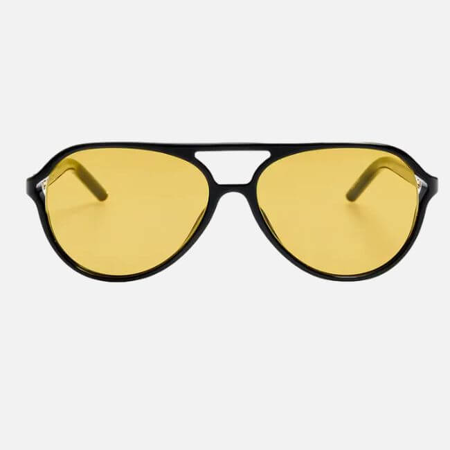 20 Nashville FINDS for June: Father's Day Gifts, Chic Accessories & More - 7 A pair of black-framed aviator sunglasses with yellow-tinted lenses, perfect for shopping Nashville’s sunny streets, displayed on a plain white background.