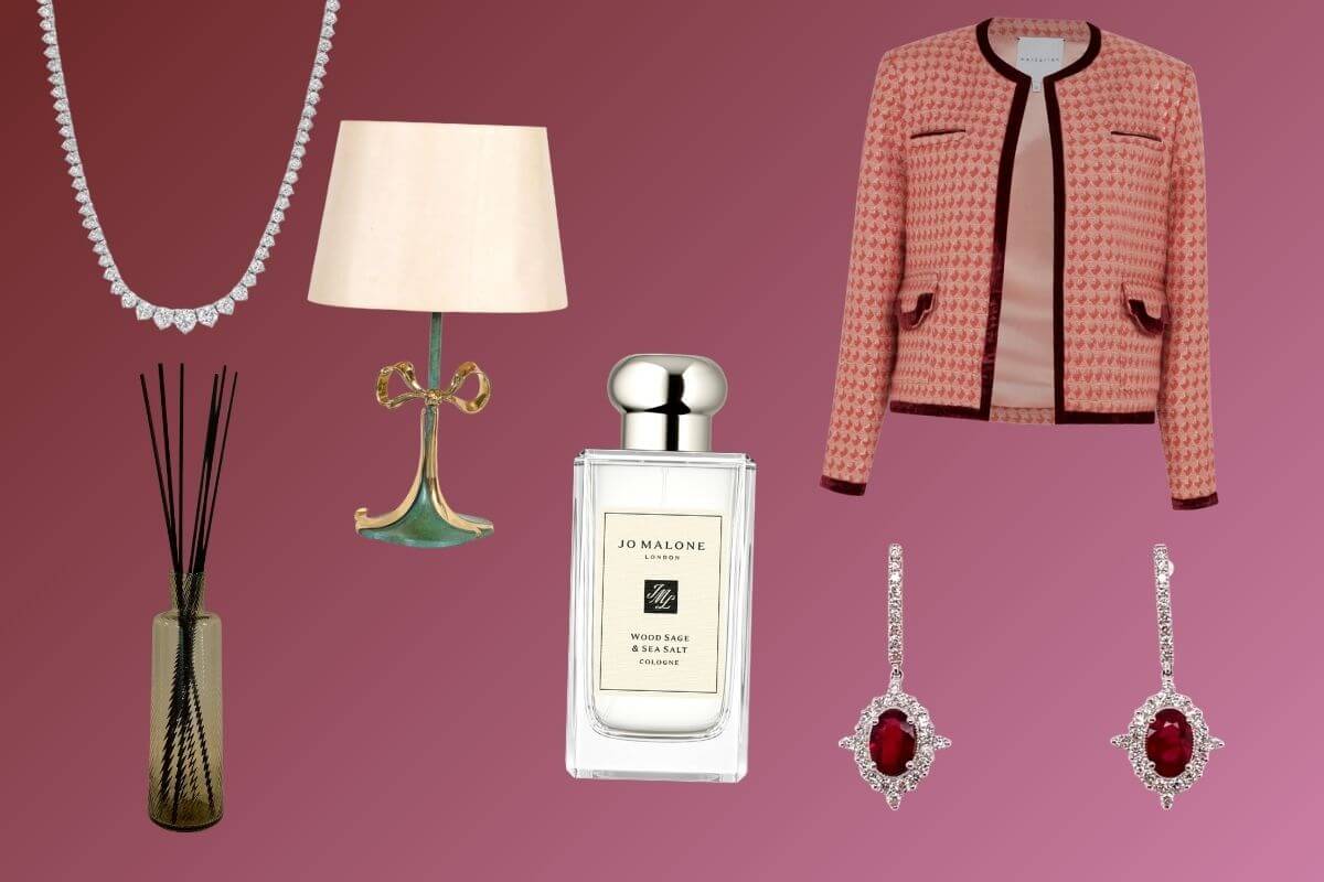 A collage featuring Birmingham Luxe Loves: a diamond necklace, decorative lamp, pink jacket, diffuser, Jo Malone perfume, and ruby and diamond drop earrings on a burgundy gradient background.