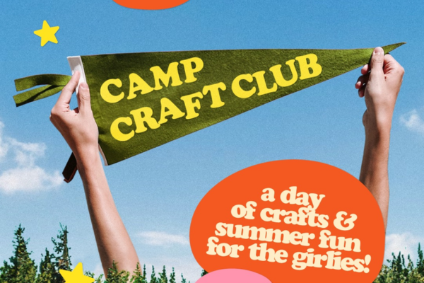 Two hands hold a green Camp Craft Club pennant against the sky, with an orange speech bubble reading "a day of crafts & summer fun for the girlies!.