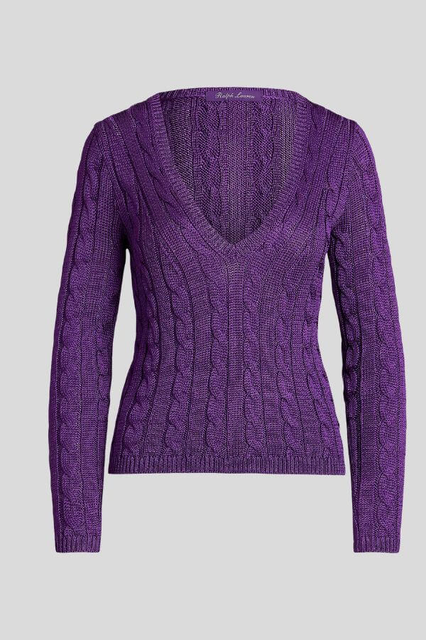 Fall 2025 Fashion: A Stylist's Lookbook of This Season's Trends - 38 A long-sleeve, purple cable knit sweater with a deep V-neck, displayed on a plain light gray background—an elegant staple inspired by Fall 2025 Fashion Trends.