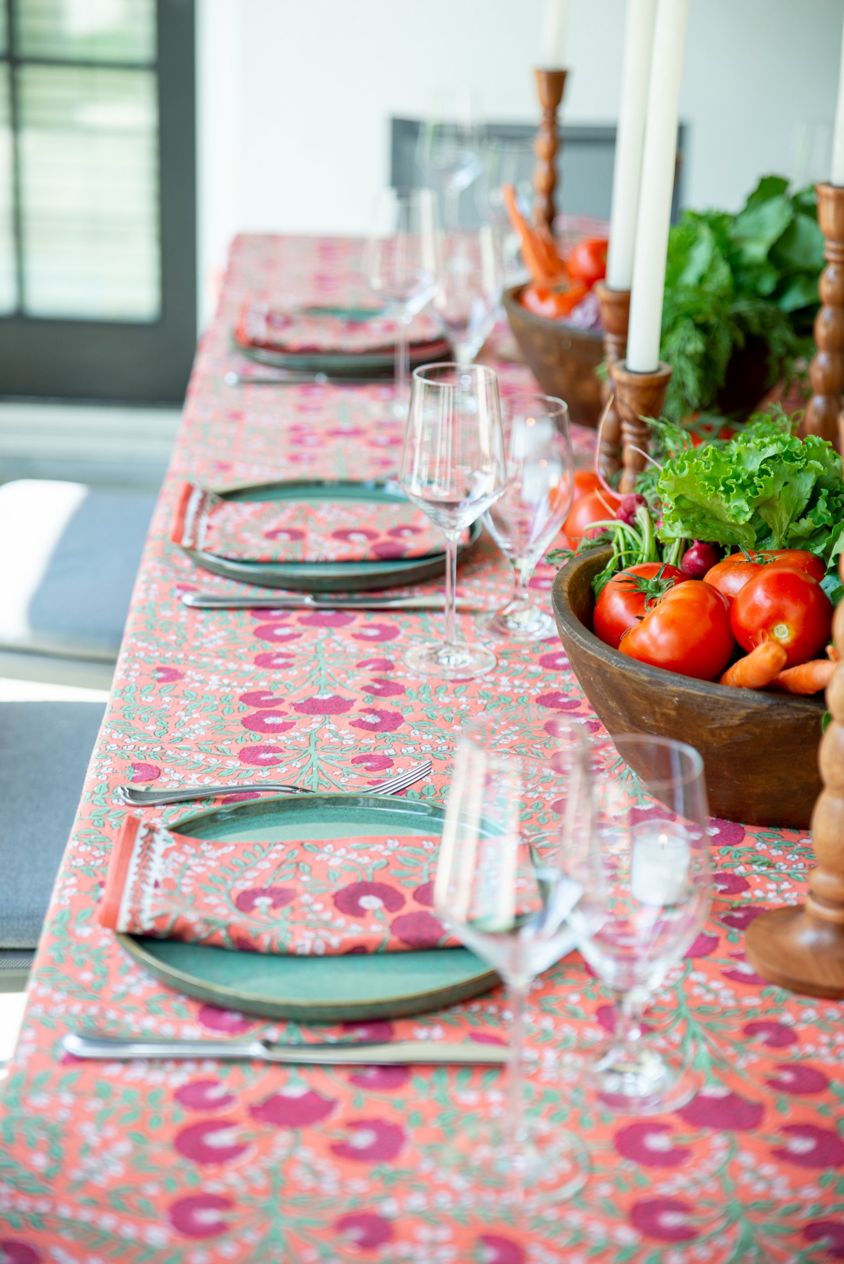Three place settings on a summer tablescape
