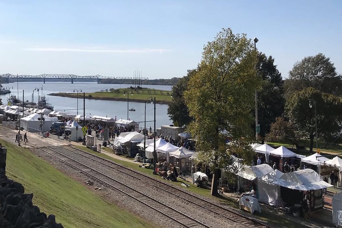 Enjoy this vibrant outdoor festival along the riverbank with white tents, near railroad tracks and a scenic bridge. Discover Memphis Happenings and experience the best of Memphis Events in October 2025.