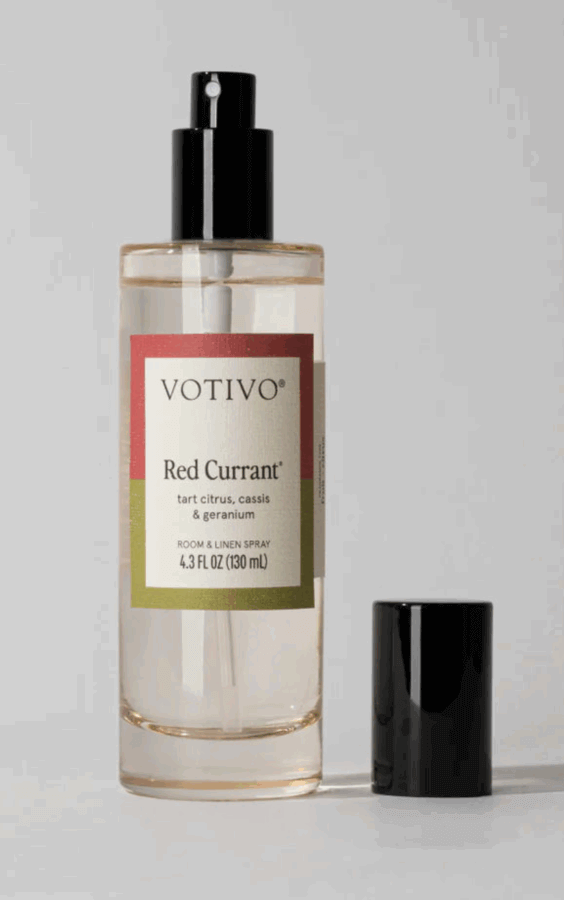 50 Under $50: Your BHAM Holiday Gift Guide - 5 A bottle of Votivo Red Currant Room & Linen Spray, 4.3 fl oz, with the black cap beside it on a light gray background—perfect for Birmingham homes and featured in our 2025 Holiday Gift Guide.