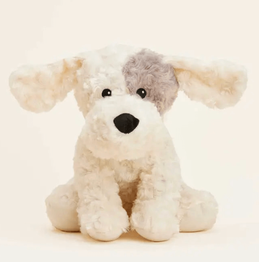 50 Under $50: Your BHAM Holiday Gift Guide - 51 A plush stuffed dog toy with floppy ears, a black nose, and a gray patch over one eye, perfect for the 2025 Holiday Gift Guide or as a charming keepsake from Birmingham, sitting on a light background.