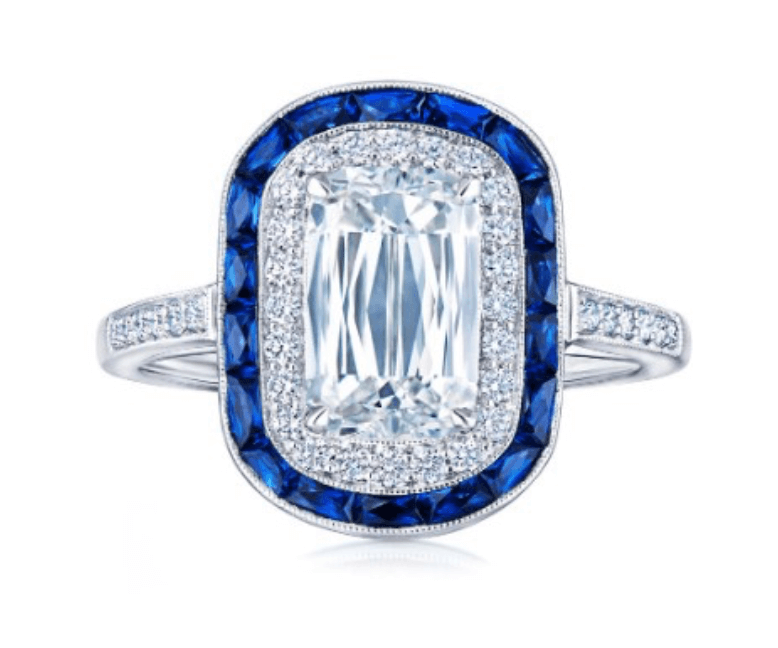 19 Luxurious Birmingham FINDS for the Holidays - 6 A rectangular diamond ring with a double halo—one of smaller diamonds and one of blue sapphires—set on a diamond-accented white gold band, this is among the most luxurious Birmingham holiday finds for those seeking unforgettable gifts.
