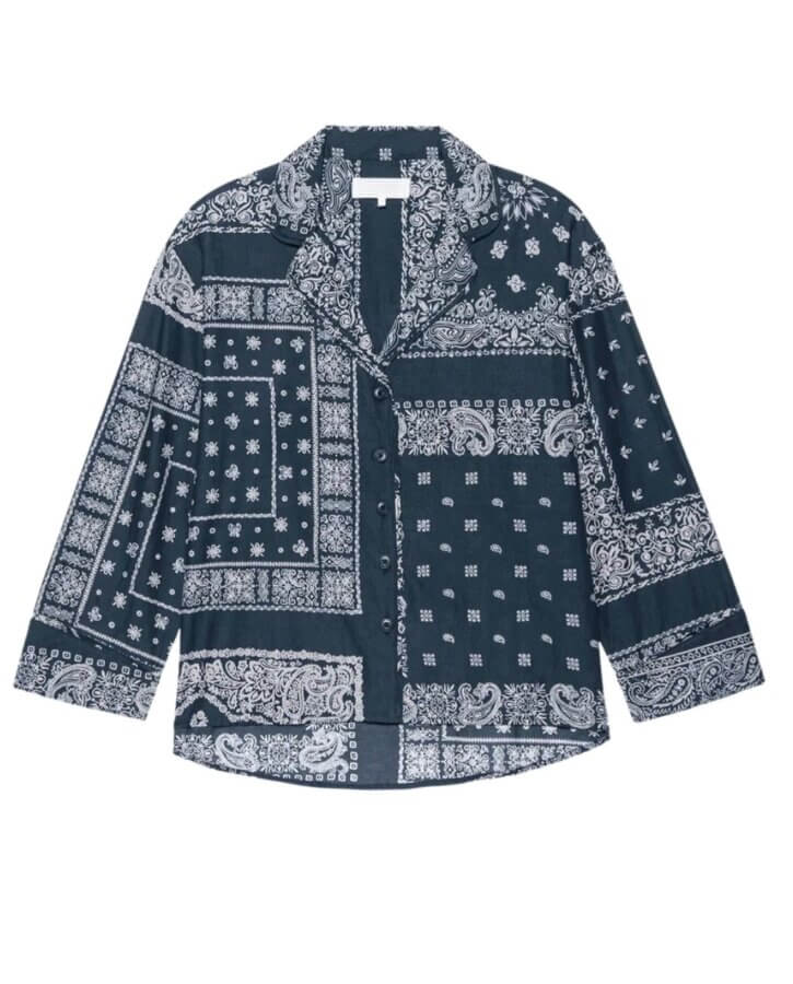 Dark blue long-sleeve button-up shirt with white bandana-style paisley and geometric print patterns—a luxe look perfect for a Nashville holiday.