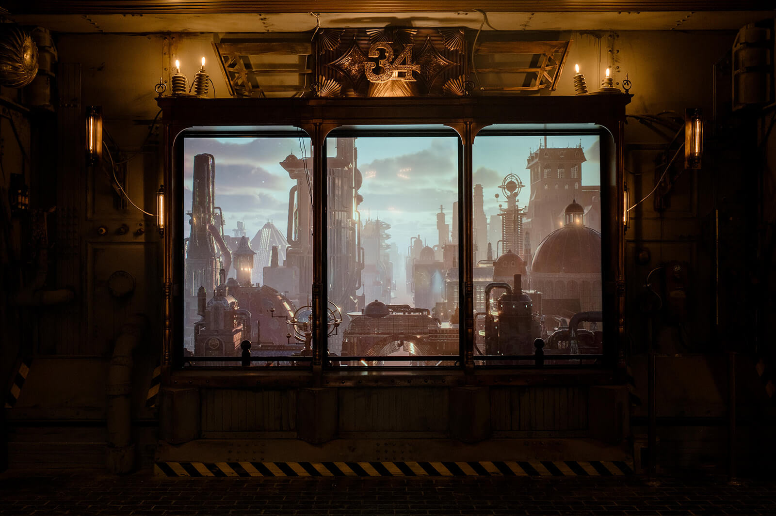A Sneak Peek at Memphis's Most Buzzed-About New Experience - 4 View through a large industrial window reveals Baron Von Opperbean’s steampunk cityscape—a place of pipes, domes, and smokestacks under cloudy skies—setting the scene for an all ages adventure.
