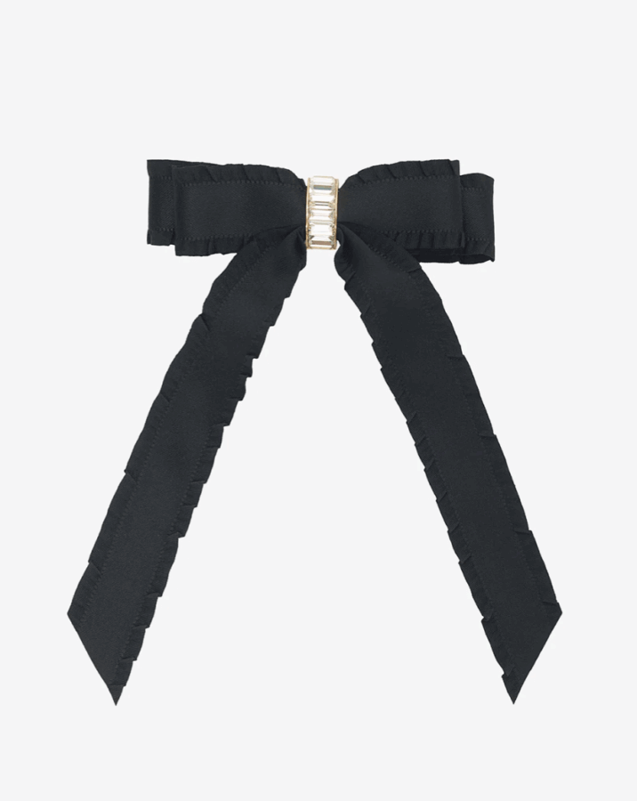 50 Under $50: Your Nashville Holiday Gift Guide - 22 A black ribbon bow with two long tails and a gold rectangular detail at the center, displayed on a plain white backgroundβan elegant pick for Gifts under $50 and perfect for any Holiday Gift Guide.