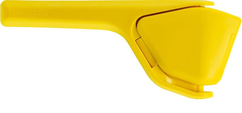 12 Nashville Chefs Share Their Go-To Culinary Gifts to Give - 4 A yellow handheld citrus squeezer with a hinged handle, shown closed, perfect for Nashville culinary enthusiasts or as a thoughtful addition to holiday gifts.