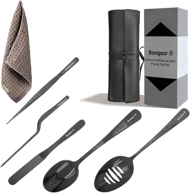 12 Nashville Chefs Share Their Go-To Culinary Gifts to Give - 8 A chef plating tool set with two tweezers, two specialty spoons, a brown towel, a black storage roll, and a branded box—ideal for culinary gifts and labeled "Bonigour 6 Piece Professional Chef Plating Tool Set.