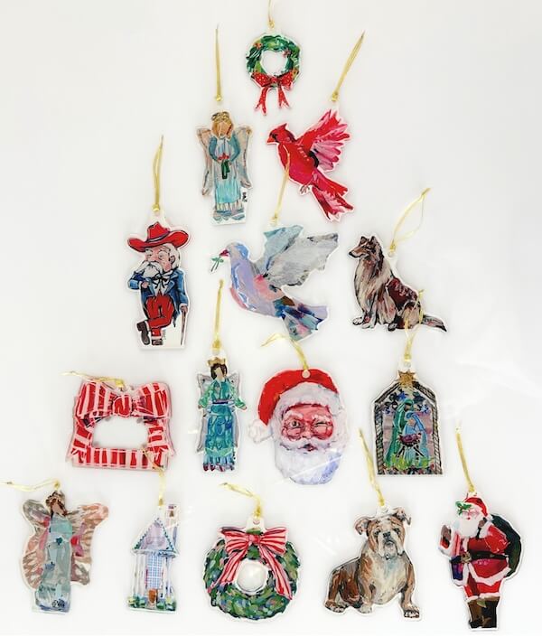 14 Southern Ornament & Stocking Shops We Love - 22 A collection of hand-painted Christmas ornaments from renowned Southern ornament purveyors, including angels, animals, wreaths, Santa Claus, and holiday-themed objects, artfully arranged on a white background.