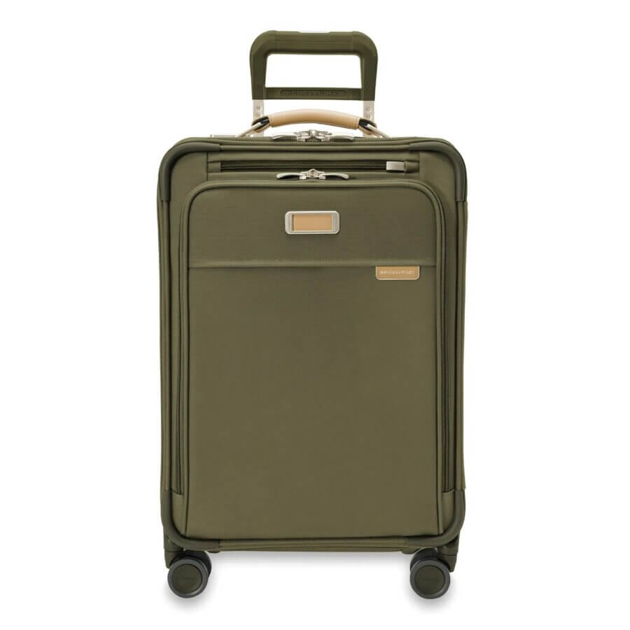 Buy It for Life: 5 Long-Lasting Travel Essentials Loved by Our Readers - 2 Olive green rolling suitcase with four wheels, a telescopic handle, front zipper pocket, and a rectangular nameplate—designed as one of your long-lasting travel essentials.