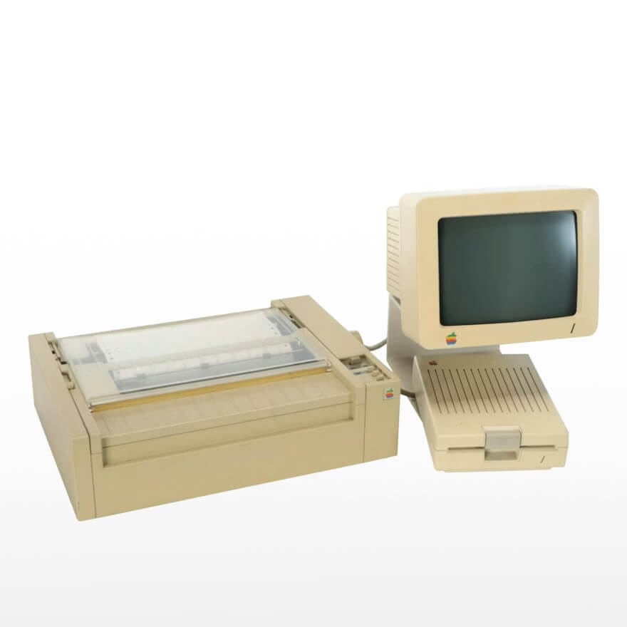 Stop Donating These 5 Items — They May Be Worth Serious Cash - 4 An early Apple desktop computer with a CRT monitor, floppy disk drive, and dot matrix printer in beige casing is displayed against a white background—perfect for those looking to donate items or find valuable items for collectors.
