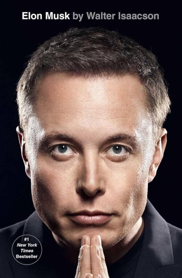 The StyleBlueprint Team's Favorite Books of 2025 - 10 Book cover featuring a close-up of a man's face with hands under chin, titled "Elon Musk by Walter Isaacson," labeled "#1 New York Times Bestseller" in the corner—a standout pick for your 2025 Reads or StyleBlueprint Favorite Books list.
