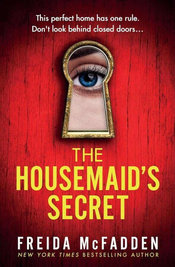 The StyleBlueprint Team's Favorite Books of 2025 - 8 Book cover for "The Housemaid’s Secret" by Freida McFadden, one of the best books of 2025, featuring a keyhole with a human eye looking through it on a red wooden background.