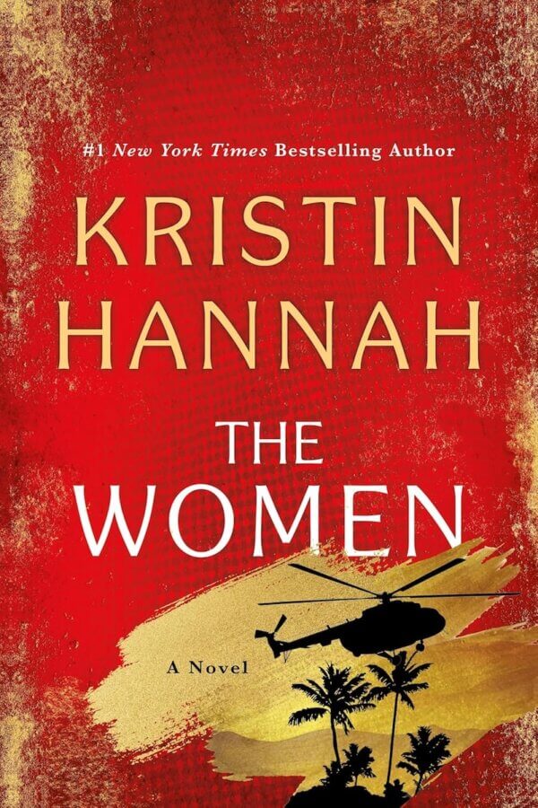 The StyleBlueprint Team's Favorite Books of 2025 - 7 The cover of the novel "The Women" by Kristin Hannah, a standout pick for 2025 reads, features gold text on a red background with a black helicopter and palm tree silhouettes.