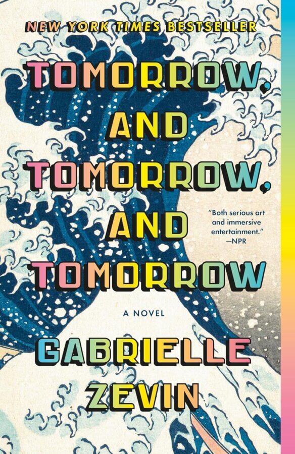 The StyleBlueprint Team's Favorite Books of 2025 - 3 Book cover of "Tomorrow, and Tomorrow, and Tomorrow" by Gabrielle Zevin, a 2025 Reads pick on StyleBlueprint, featuring stylized text over a wave pattern inspired by traditional Japanese art.