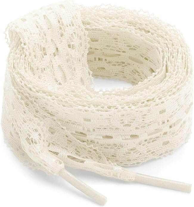 Trend Alert: Lace is Back! - 17 Trend alert: A coiled roll of off-white lace tshoelaces.