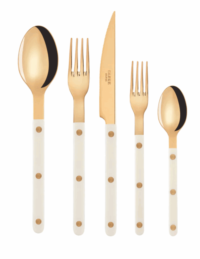17 Birmingham FINDS for the New Year - 18 Ring in the New Year with this Birmingham FINDS: a five-piece gold and white flatware set, featuring a knife, two forks, and two spoons—each adorned with chic white handles and gold circular accents.