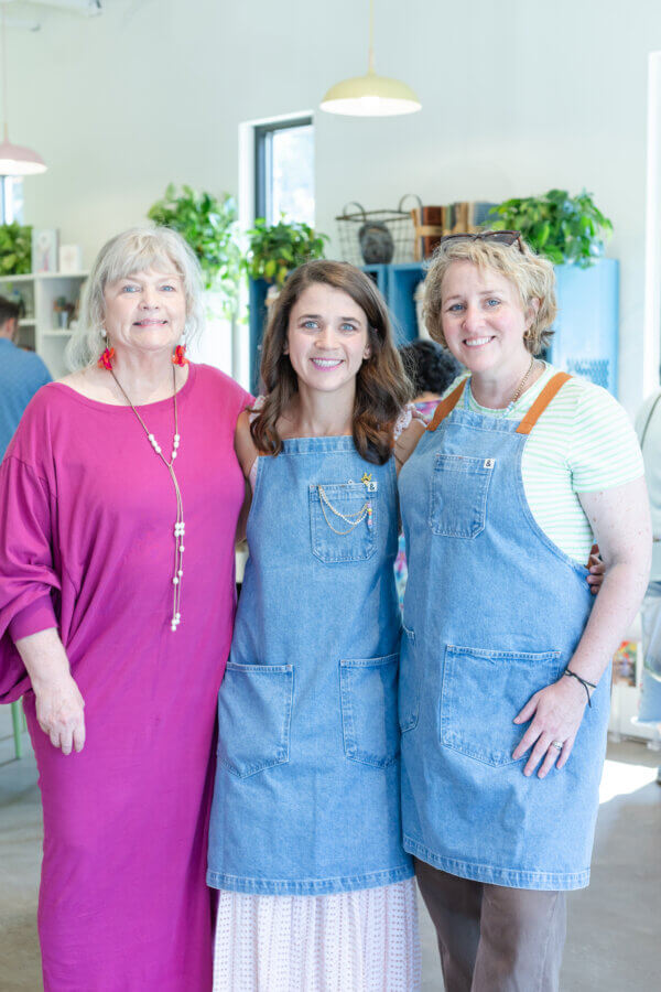 This BHAM Engineer Creates Community Through ... Crafting! - 3 Blakely O'Connor poses for a photo in the middle of her mother and sister at The Craft Room.
