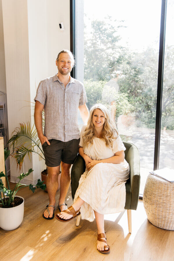 Meet Jasmin Day of Ease Wellness & JDay Bakes - 3 Jasmin Da y and her husband pose in their home.