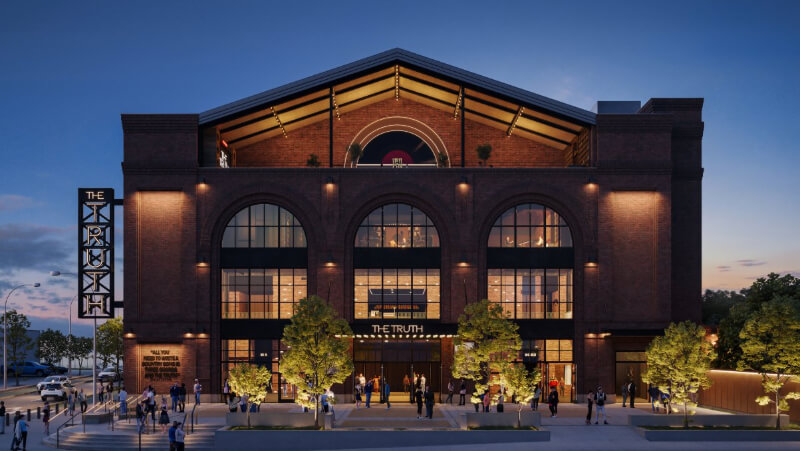 Coming Soon to Nashville! 10 Exciting Additions - 9 A large brick building in Nashville with arched windows and exterior lights, labeled "The Truth," has people gathered at the entrance in the evening of 2026.