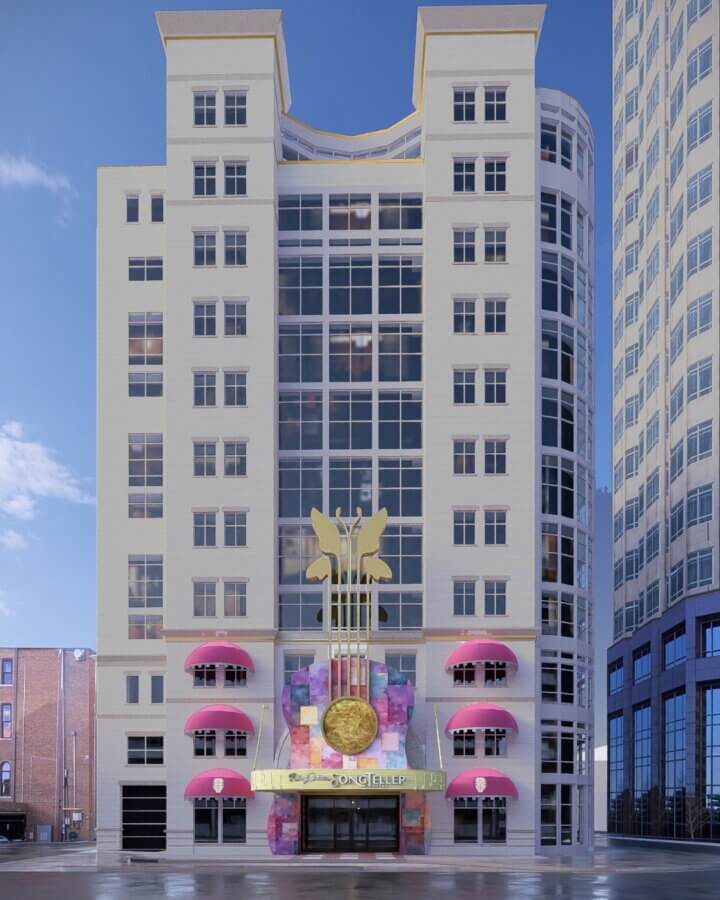 Coming in 2026! Exciting Developments to Watch Around the South - 5 A white multi-story building with pink awnings, a large gold clock, and a decorative guitar on the front facade hints at exciting developments in the South, nestled between two other buildings.