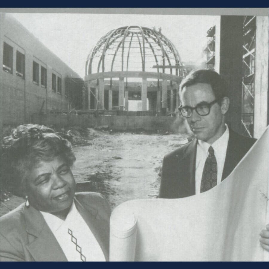 4 Remarkable Women in Birmingham's Black History - 4 Odessa Woolfolk stands by a man in front of the construction site for the Birmingham Civil Rights Institute, looking at blueprints together.