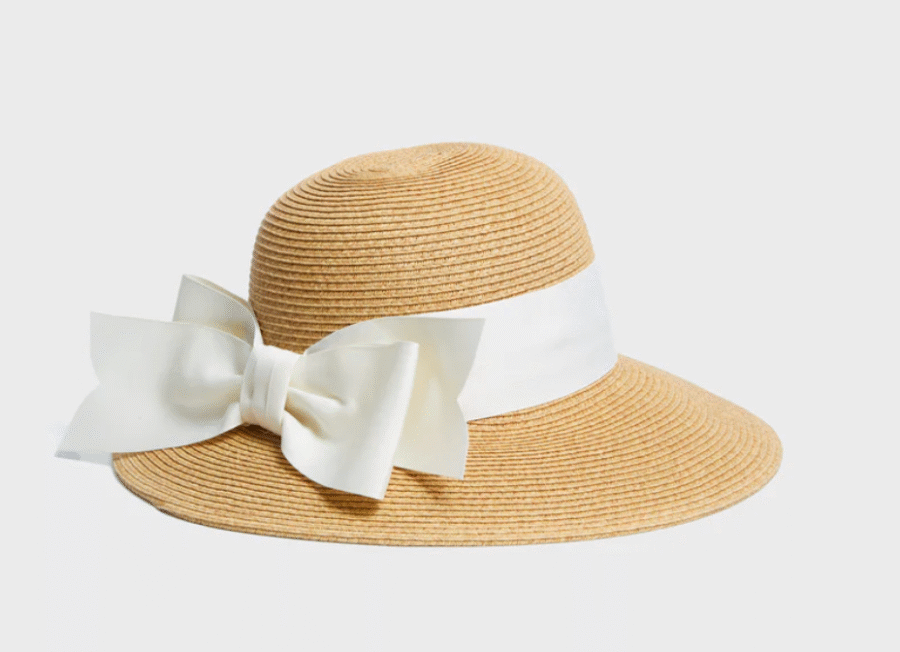 8 Crushable Hats, Perfect for Travel - 5 Wide-brimmed straw hat with a large white ribbon and bow around the crown, shown on a plain light background.