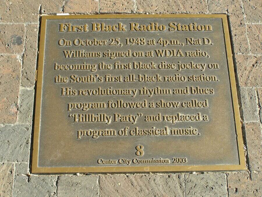 Bronze plaque commemorating the first Black radio station, honoring Nat D. Williams and his show on WDIA Radio, installed by Center City Commission in 2003—an enduring tribute for Black History Month.