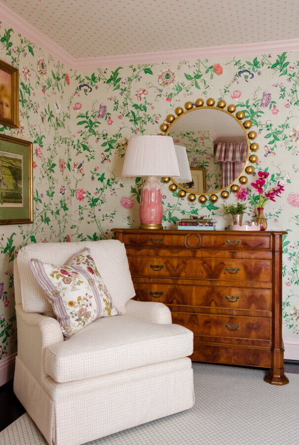 Something Old, Something New: How Ellie Christopher Makes Antiques Feel Fresh - 6 An antique chest with a pink lamp and a mirror over it next to a crean colored chair.