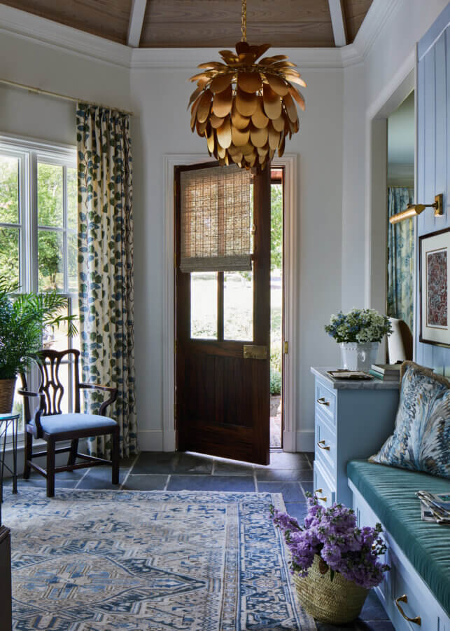Something Old, Something New: How Ellie Christopher Makes Antiques Feel Fresh - 11 Entry way in shades of blue with a brown overhead light fixture
