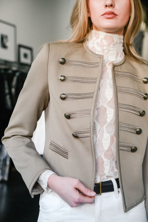 Nashville's Spring 2026 Style Edit: Playful Layers, '90s Inspiration & More - 14 A close-up of a beige jacket with buttons.
