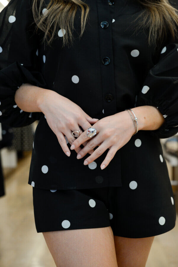 Nashville's Spring 2026 Style Edit: Playful Layers, '90s Inspiration & More - 3 Woman wearing a two-piece polka dot outfit.