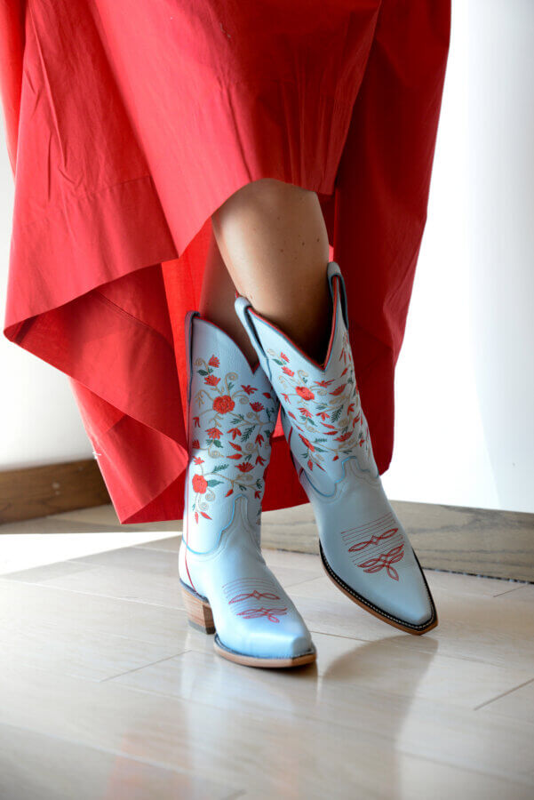 Nashville's Spring 2026 Style Edit: Playful Layers, '90s Inspiration & More - 7 Close-up of light blue cowboy boots with red flowers.
