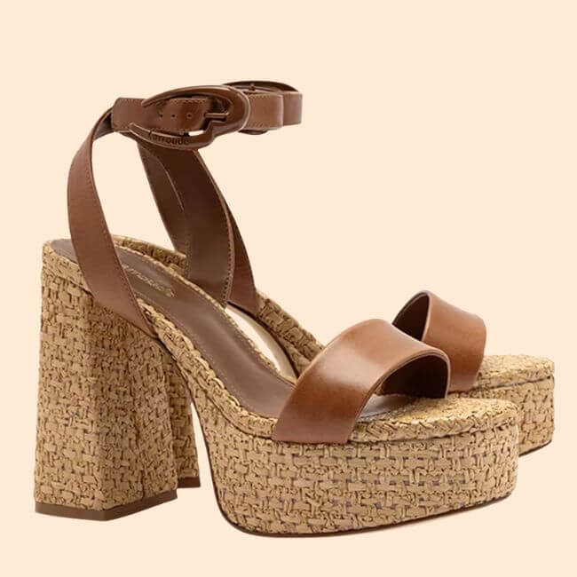 17 Springy Birmingham FINDS! - 10 Step into Spring with these brown platform sandals featuring ankle straps, thick high heels, and woven straw-textured soles—perfect for strolling through Birmingham in style. Displayed against a plain beige background.