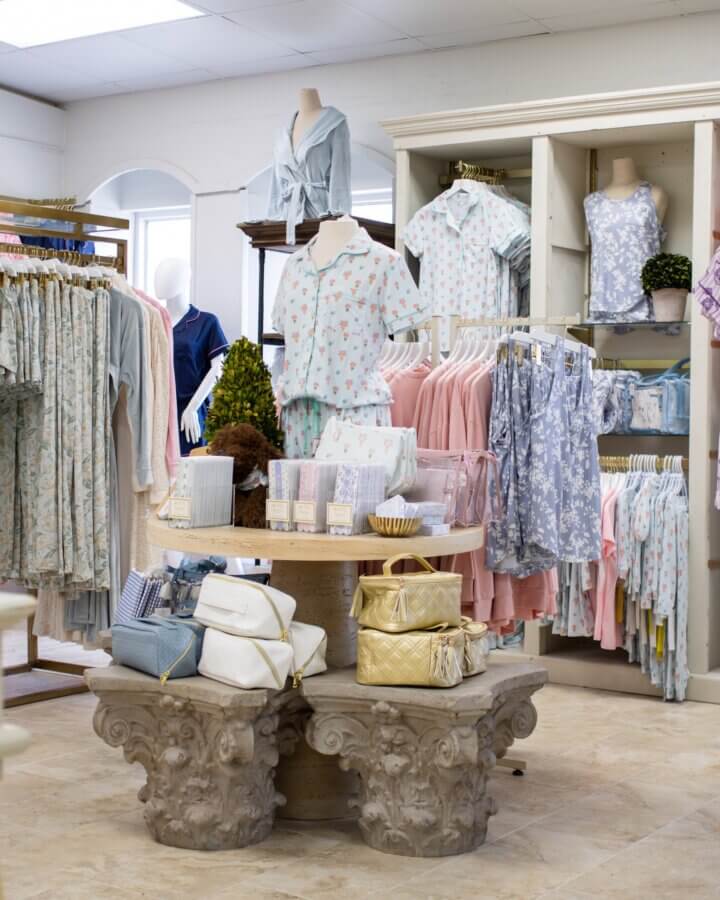 10 New Retail Spots to Check Out in BHAM (+1 Coming Soon!) - 2 A boutique display at The Royal Standard of pastel-colored women’s clothing, accessories, and bags arranged on racks and tables in a well-lit store.