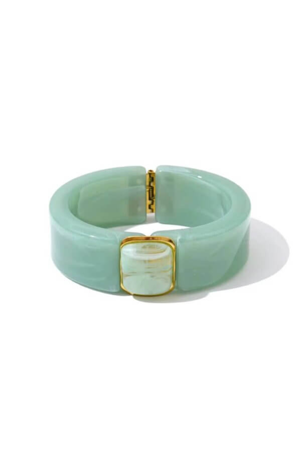 18 Nashville FINDS We're Loving This Month - 8 A wide mint-green resin bracelet from the FINDS Draft March 2026 collection, featuring a gold-toned hinge and clasp with a rectangular marbled light-green accent on the front.