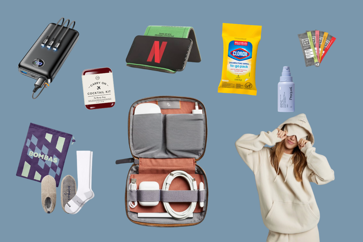 Flat lay of various travel and plane accessories, including a power bank, card holder, disinfecting wipes, Netflix gift card, cocktail kit, socks, lint brush, tech organizer, and a woman in a hoodie.