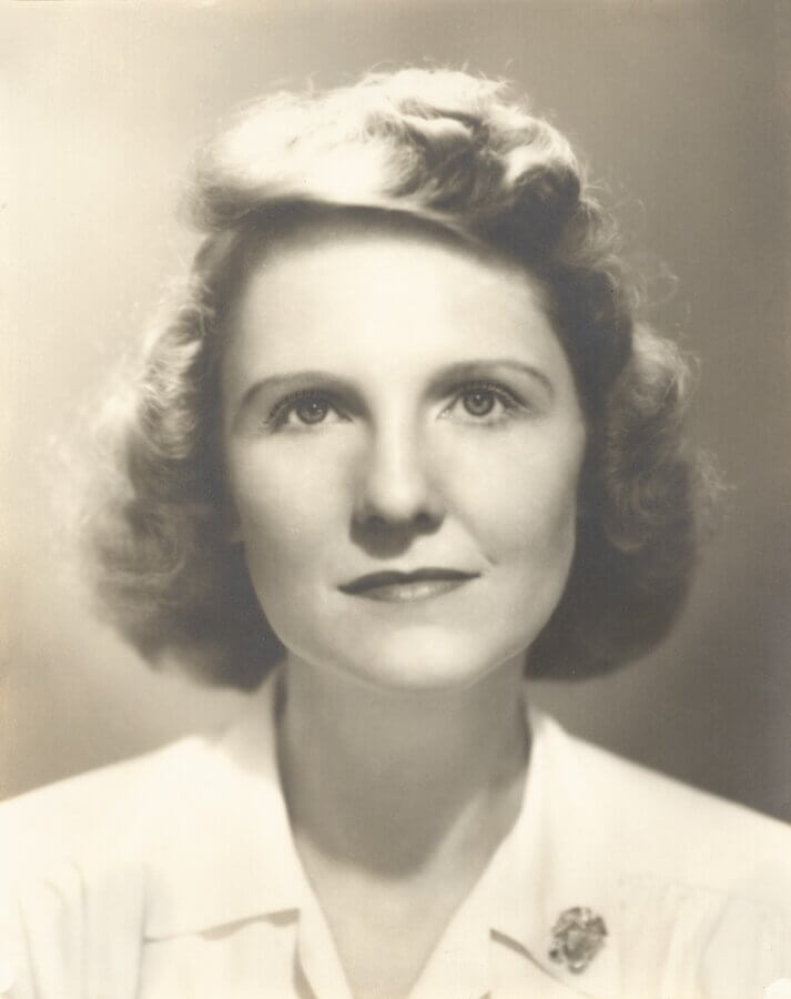 Meet the Visionary Behind Maker’s Mark: Margie Samuels - 2 Black and white portrait of visionary Margie Samuels, with wavy, shoulder-length hair, wearing a light-colored blouse and looking slightly upward.