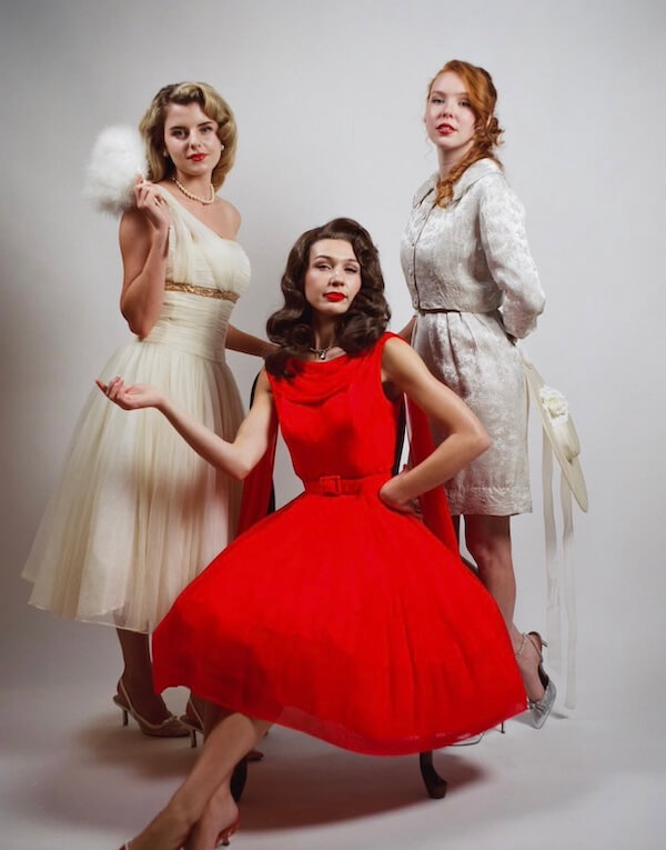 Estelle Amore: New Vintage Bridal Destination - 2 Three women pose in vintage-style dresses.