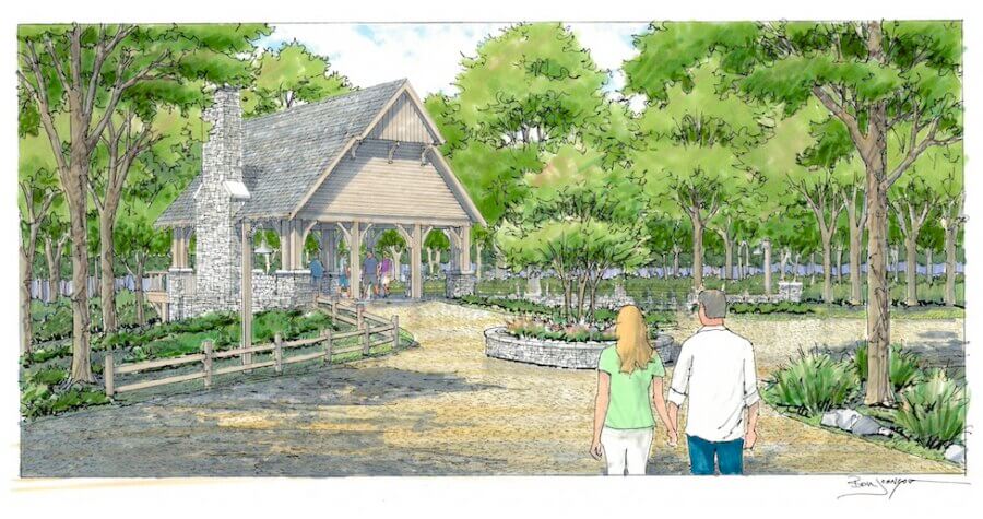 Inside The Arbors: A Rare Opportunity in Leiper's Fork - 7 A couple walks toward The Arbors, a wooden pavilion with a stone chimney, surrounded by trees, plants, and a circular garden in a landscaped park setting.