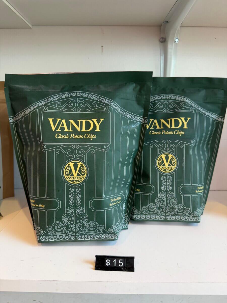 20 Spring FINDS for Mother’s Day & Beyond: Style, Beauty & Home Must-Haves - 19 Two green bags of Vandy Classic Potato Chips are displayed on a white shelf in Nashville, with a price tag showing $15 in front of them—perfect for your FINDS Draft shopping list this May 2026.