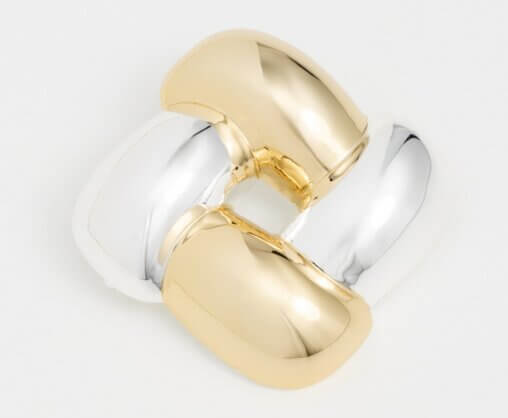 It's the Year of the Brooch! Here's How to Style Them - 11 A square-shaped brooch, part of our unique brooches collection, features two gold and two silver rounded segments arranged alternately on a white background.