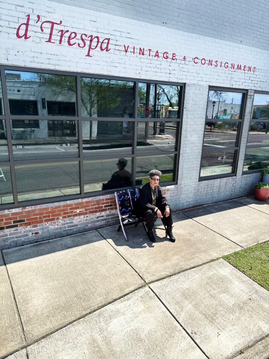 She Curates One of Birmingham’s Top Vintage & Consignment Boutiques - 4 LaRoyce Marsh sits on a folding chair outside d'Trespa in Woodlawn.