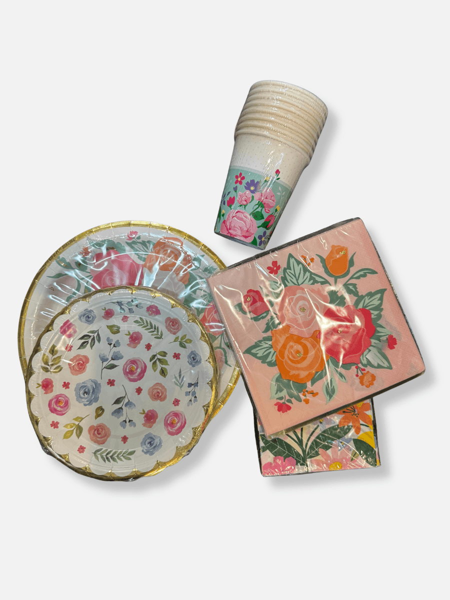 15 Louisville FINDS for May: Spring Fashion, Entertaining Essentials & More - 10 Assorted floral-themed disposable plates, cups, and napkins arranged on a white backgroundβperfect for May events or Louisville gatherings.