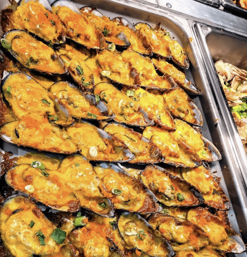 5 New Memphis Restaurants to Try This Month (+ What's Coming Soon!) - 5 A tray filled with baked mussels topped with melted cheese and garnished with chopped green onions.