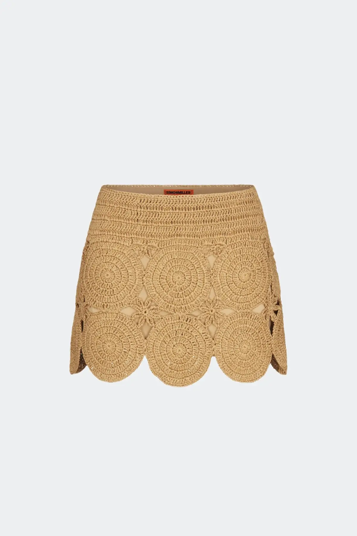 4 Easy, Breezy Fashion Trends for Summer 2026 - 2 Tan raffia mini skirt with scalloped hem and circular pattern detailing, displayed against a plain light background—a must-have piece inspired by 2026 Summer Trends.