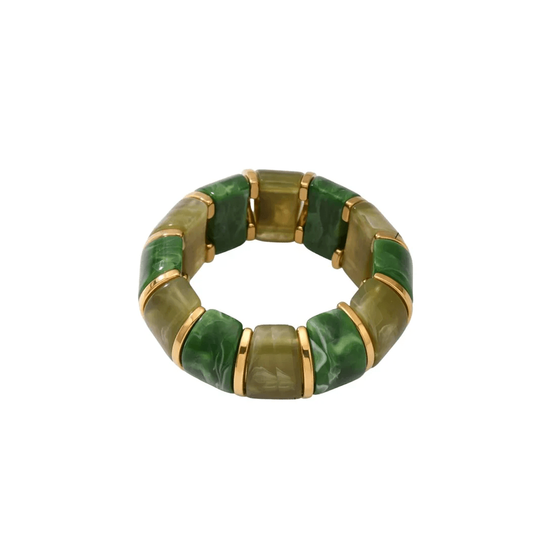 Green and gold segmented bracelet with rectangular pieces, arranged in a circular shape against a white background—a unique FINDS from Nashville perfect for May style statements.